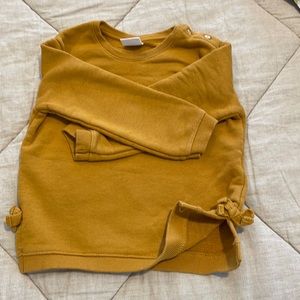 Zara mustard color sweatshirt with side slits.